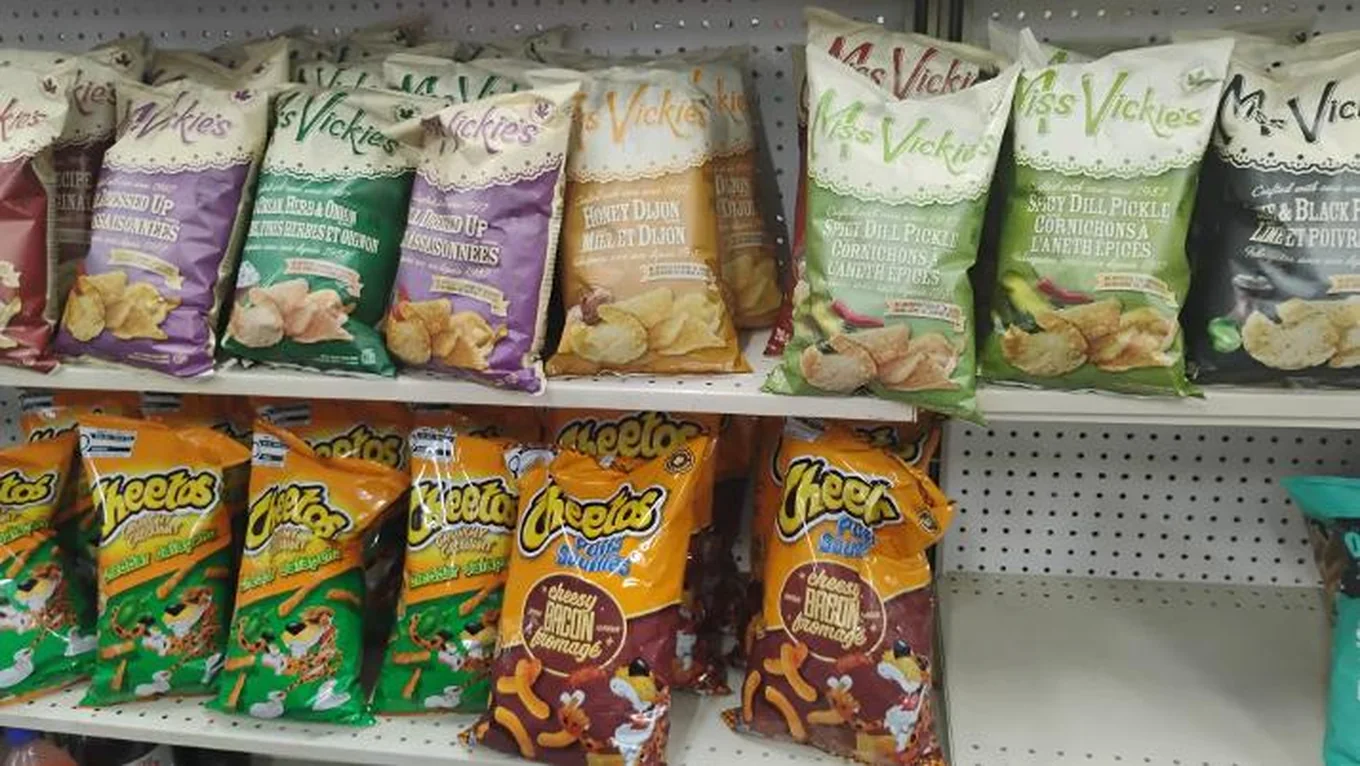 Miss Vickie’s chips and Cheetos on the snack shelf at Northmount Convenience Store