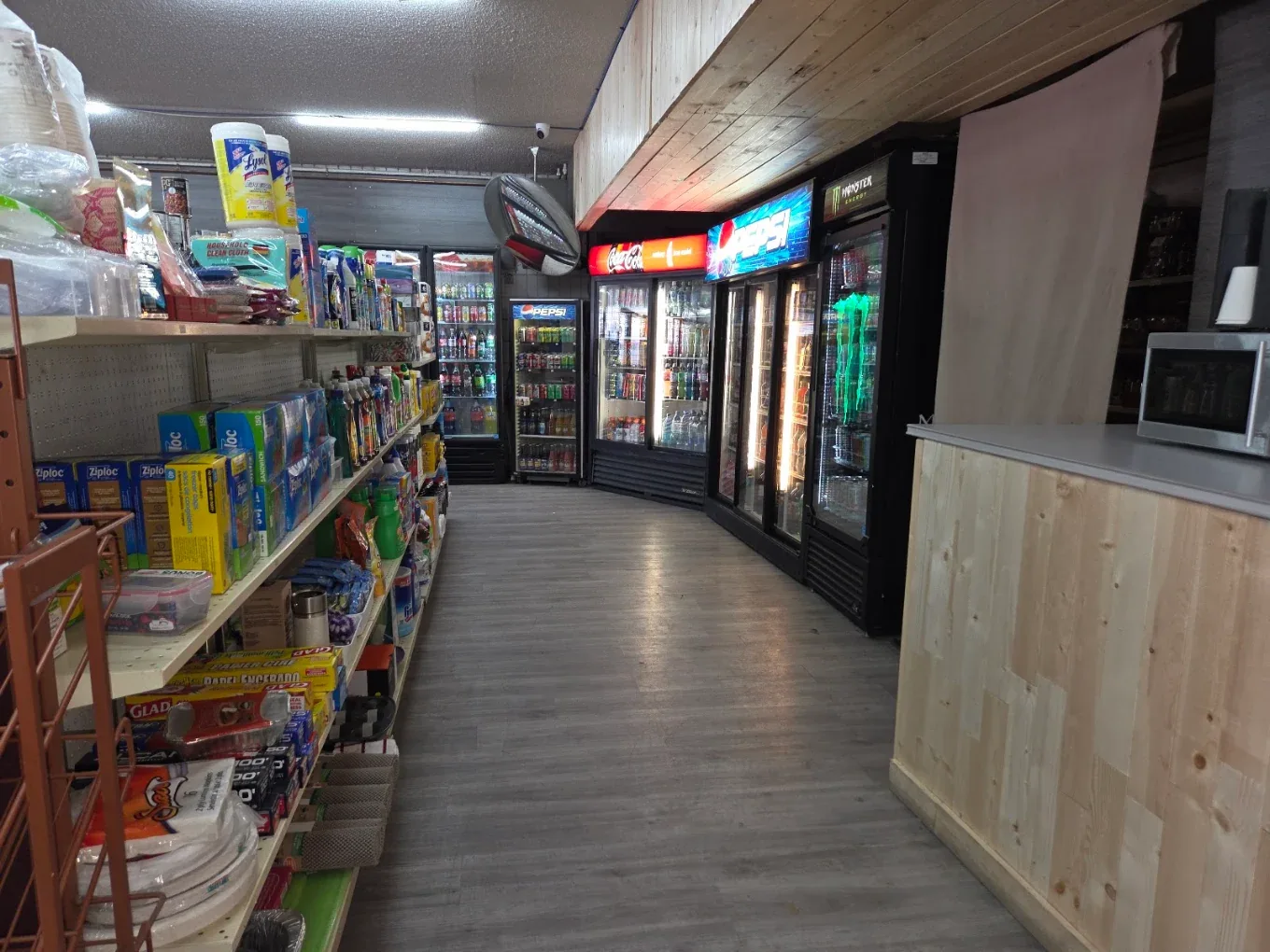 Household aisle and coolers at Northmount Convenience Store