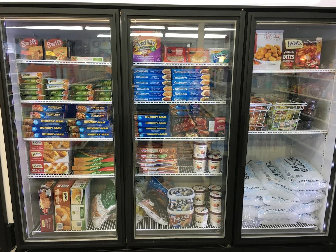 Frozen meals and bagged ice at Northmount Convenience Store